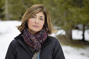 Woman on the snow in the mountains