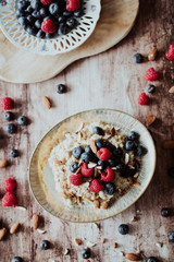 Porridge bowl, oat meal with blueberries, raspberries and   almond splits
