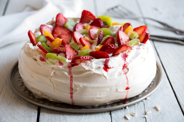 Delicious Pavlova cake with meringue and fresh strawberries