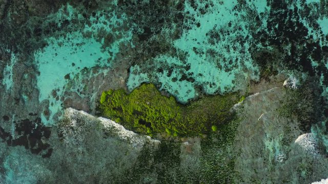 Aerial drone flight over coral reef, Melasti beach, Bali, Indonesia, 4k