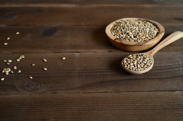 hemp seeds on a wooden background as a healthy food concept