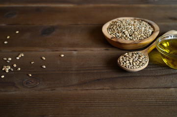 hemp seeds on a wooden background as a healthy food concept