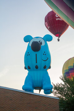 BRANCHBURG, NEW JERSEY - July 28, 2018: Hot air balloons land next to the Midland School after launching at the Quick Chek Festival of Ballooning.