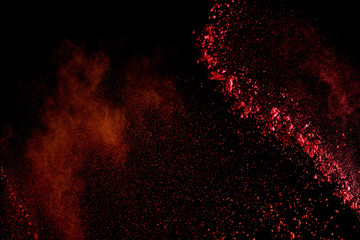 red colorful holi paint explosion on black background