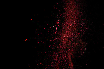 red colorful holi paint explosion on black background
