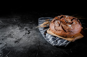 Fresh baked bread on dark background