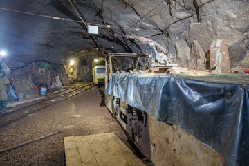 Gold mine underground tunnel with electric locomotive