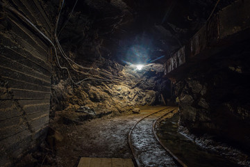 Fototapeta na wymiar Gold mine underground tunnel with light