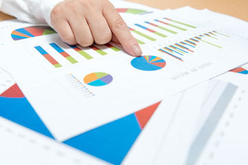 business, office, tax, school and education concept - woman hands with charts and papers