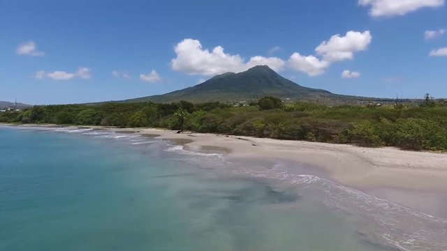Saint Kitts and Nevis, Caribbean - The Wonderful Scenery Of Blue Calm Ocean With Glorious Trees and Beautiful Mountain - Aerial Shot