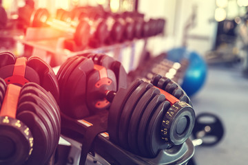 Close up dumbells set for a exercise in the fitness gym.