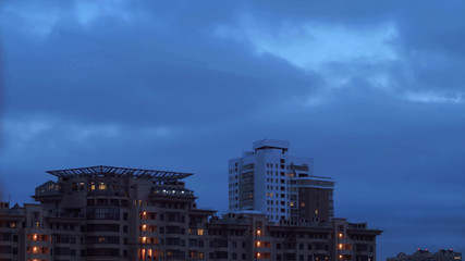 Dark cloudy sky over city buildings