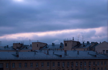 Dark cloudy sky over city buildings