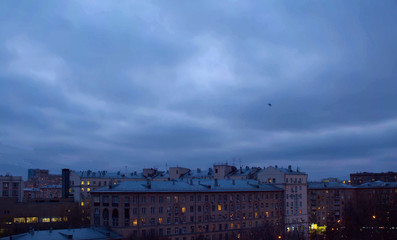Dark cloudy sky over city buildings