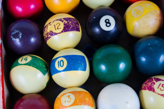 billiard balls on pool table