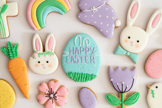 Happy Easter. Multicolored pastel easter cookies on a white background.