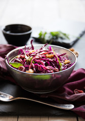 Red cabbage salad with nuts and arugola