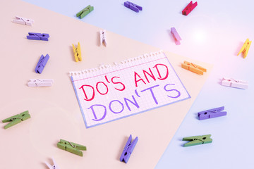 Writing note showing Do S And Don tS. Business concept for Rules or customs concerning some...