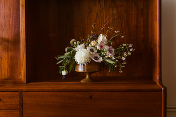 Sophisticated bouquet of flowers on wooden table