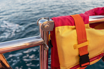 Fototapeta premium Personal flotation device as a life jacket on a boat at sea