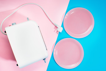 set of trendy Breakfast or other food items: two pink plates and a white Breakfast toaster