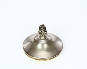 Antique silver lid to the bowl  for sugar and milk on  the white background