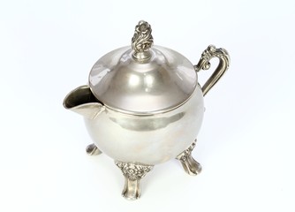 Antique silver bowl for milk on  the white background