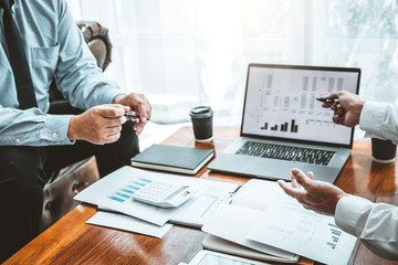 Business team meeting Strategy Planning with new startup project plan Finance and Economy Graph with laptop successful teamwork