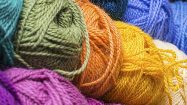 Colorful balls of wool thread for knitting. Closeup.