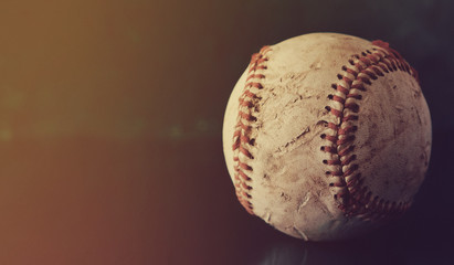 Old baseball sport background with copy space by leather game ball, rough vintage texture.