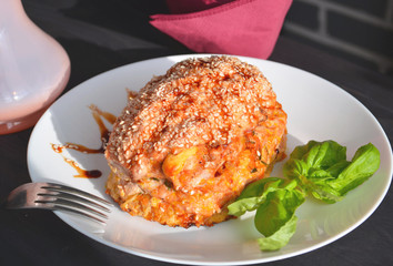 Thanksgiving, holiday, dinner. Cupcake casserole with chicken, carrots, onions and cheese on a wooden table. Food concept on a festive table.
