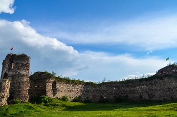 Fototapeta na wymiar Summer view to castle ruins in Buchach with beautiful sky and clouds, Ternopil region, Ukraine