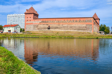 Naklejka na ściany i meble View of the Gedimina Castle (Lida castle) from the lake, Lida, Belarus. 