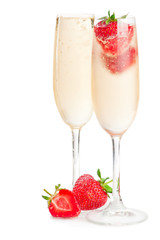 Two glasses of sparkling wine (champagne) and strawberry on white