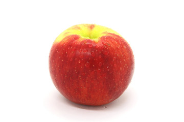 The fruit is a red and yellow Apple on a white background. Great tasty snack.