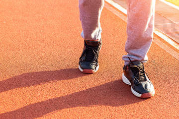 Sport Man jogging or exercise on track race at Stadium.Sport concept.