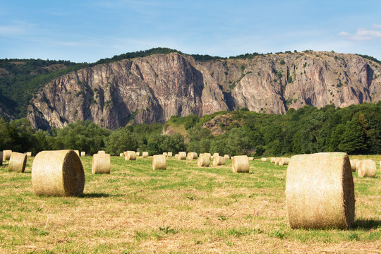 Germany, Rhineland-Palatinate, Bad Munster am Stein-Ebernburg, hay bales in front of the Rotenfels