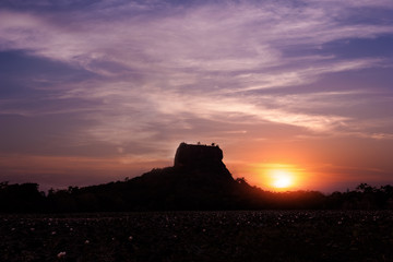 Sunset silhouette of Lion Rock. Sigiriya, Sri Lanka