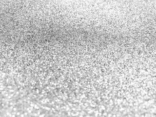 Silver shiny glitter abstract texture background.