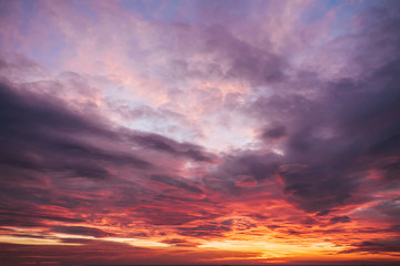 Cloudy sky on sunset with blue and yellow colors