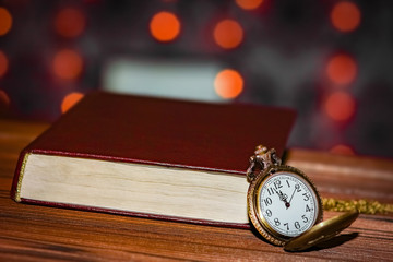 pocket watch with book background