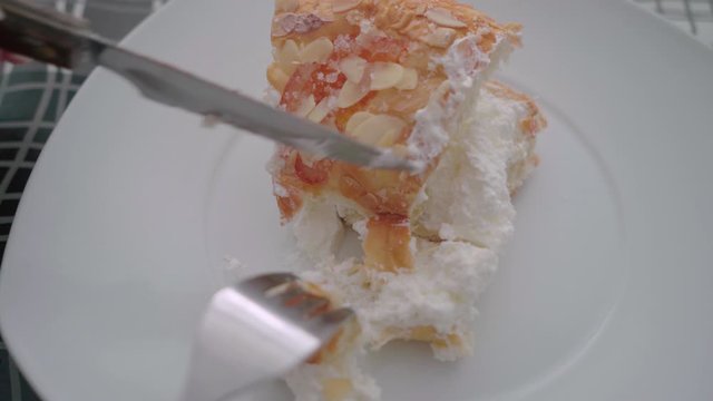 Finding surprise haba bean in Spanish Roscon de Reyes Cake, Closeup