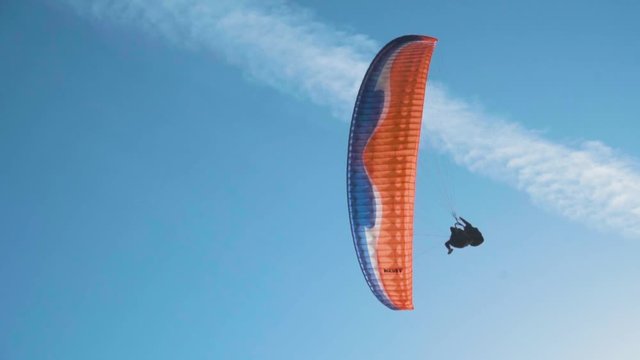 Silhouette Man Paragliding Beautiful Summer Sunset Sky. Paraglide flight experience skydive summer