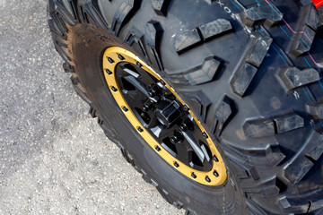 Car wheels close up on a background of asphalt