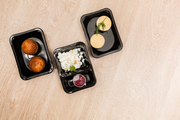 Healthy food delivery. Take away food for diet in plastic boxes. Top view, flat lay.