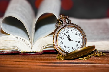 pocket watch with book background