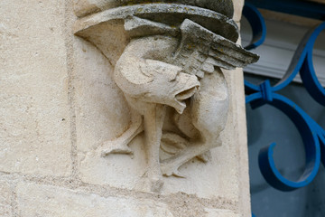 Closeup architectural details of ancient historic castle or chateau in France - wild animal sculpture