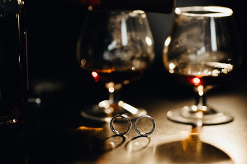  Wedding rings and glasses of cognac