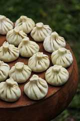 National Georgian cuisine. Khinkali on the pottery. Georgian food