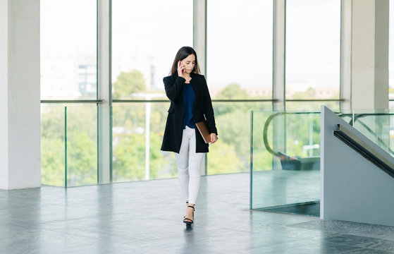 Businesswoman on the go talking on the phone